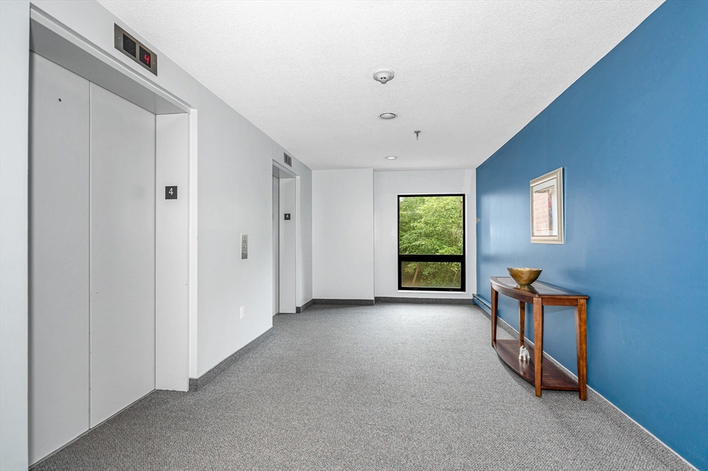 4 Summit Drive, Unit 413 Reading, MA 01867 - Photo 18 of 20 a view of empty room with windows