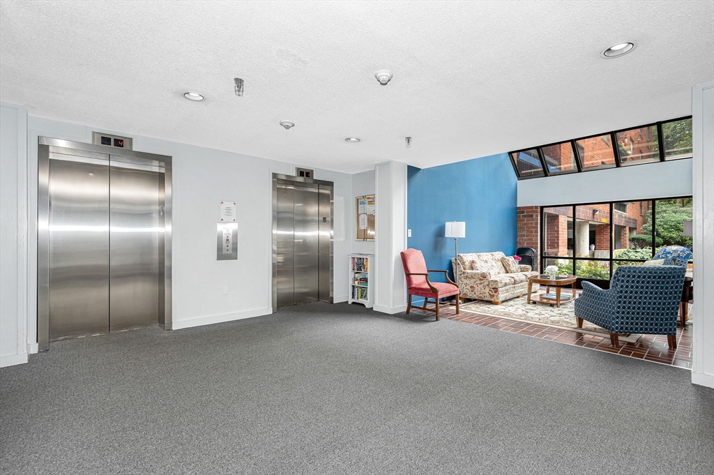 4 Summit Drive, Unit 413 Reading, MA 01867 - Photo 19 of 20 a living room with furniture and a interior