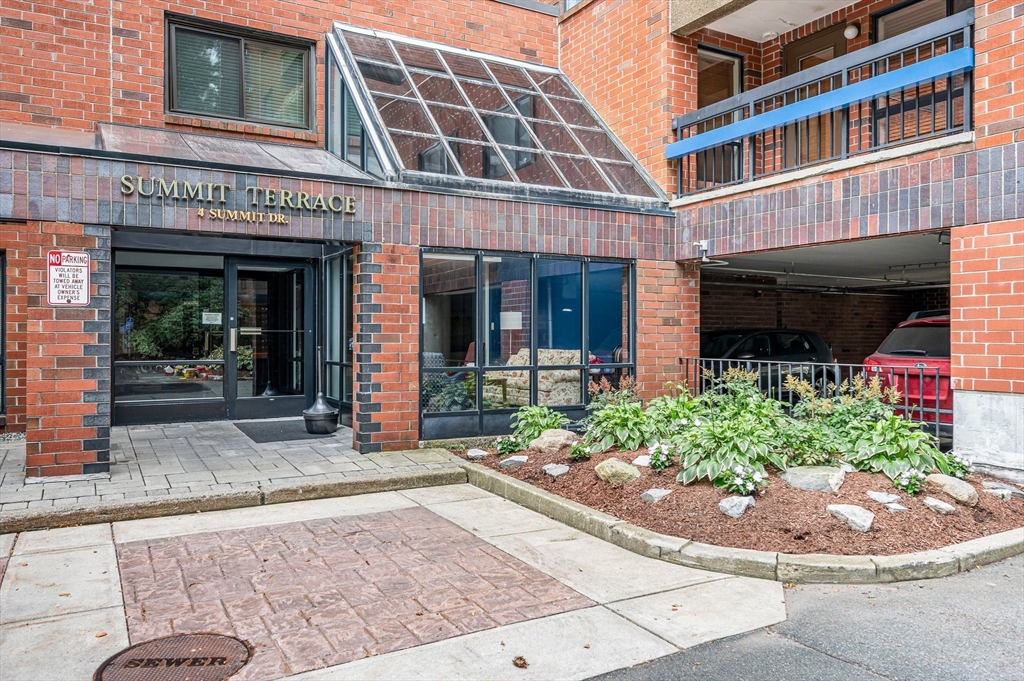 4 Summit Drive, Unit 413 Reading, MA 01867 - Photo 2 of 20 front view of a building