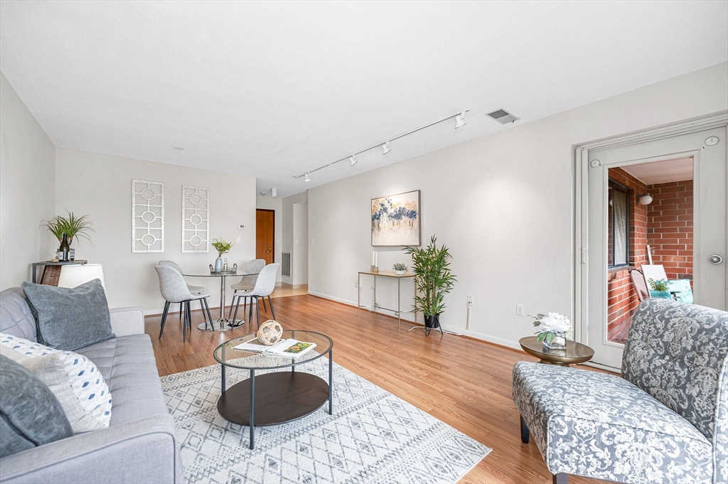 4 Summit Drive, Unit 413 Reading, MA 01867 - Photo 5 of 20 a living room with furniture and wooden floor