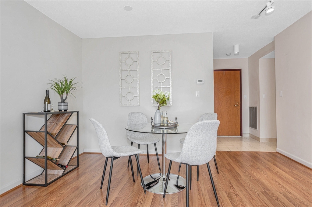4 Summit Drive, Unit 413 Reading, MA 01867 - Photo 8 of 20 a view of a dining room with furniture and wooden floor