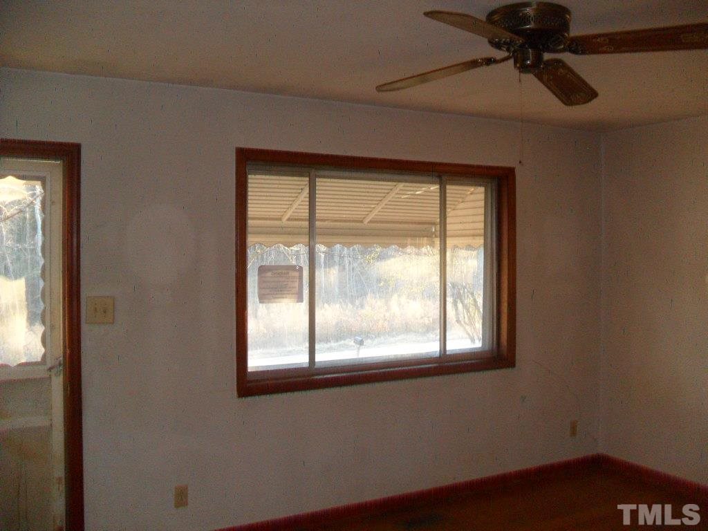 4611 Bragg Road Durham, NC 27704 - Photo 3 of 10 a view of an empty room with a window