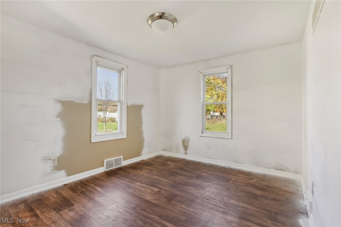 1733 Ronald Road Akron, OH 44312 - Photo 12 of 33 Spare room with dark hardwood / wood-style floors
