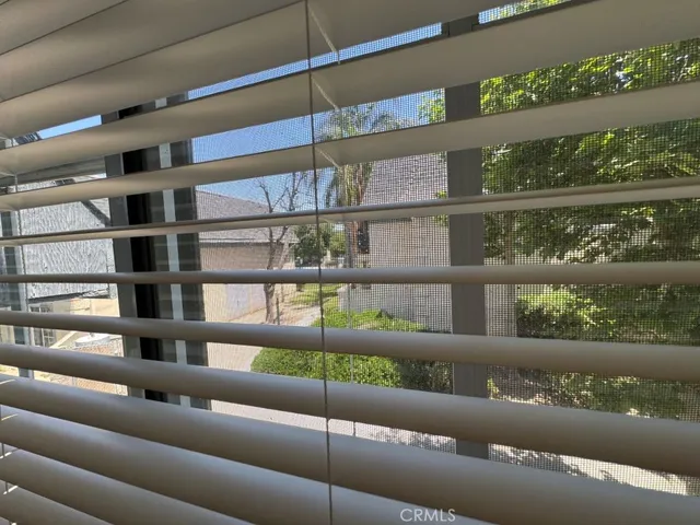 a view of a white house with a yard