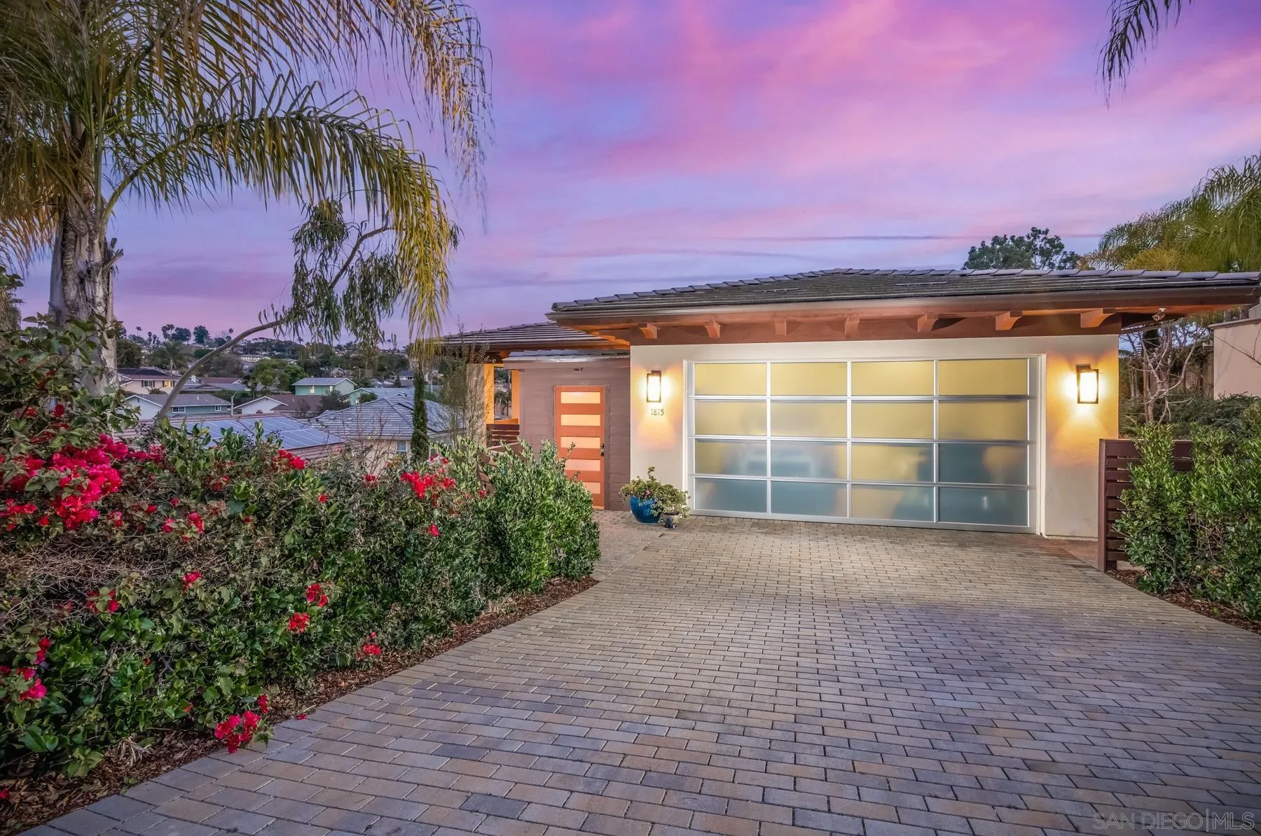 a view of a house with a yard and a garage