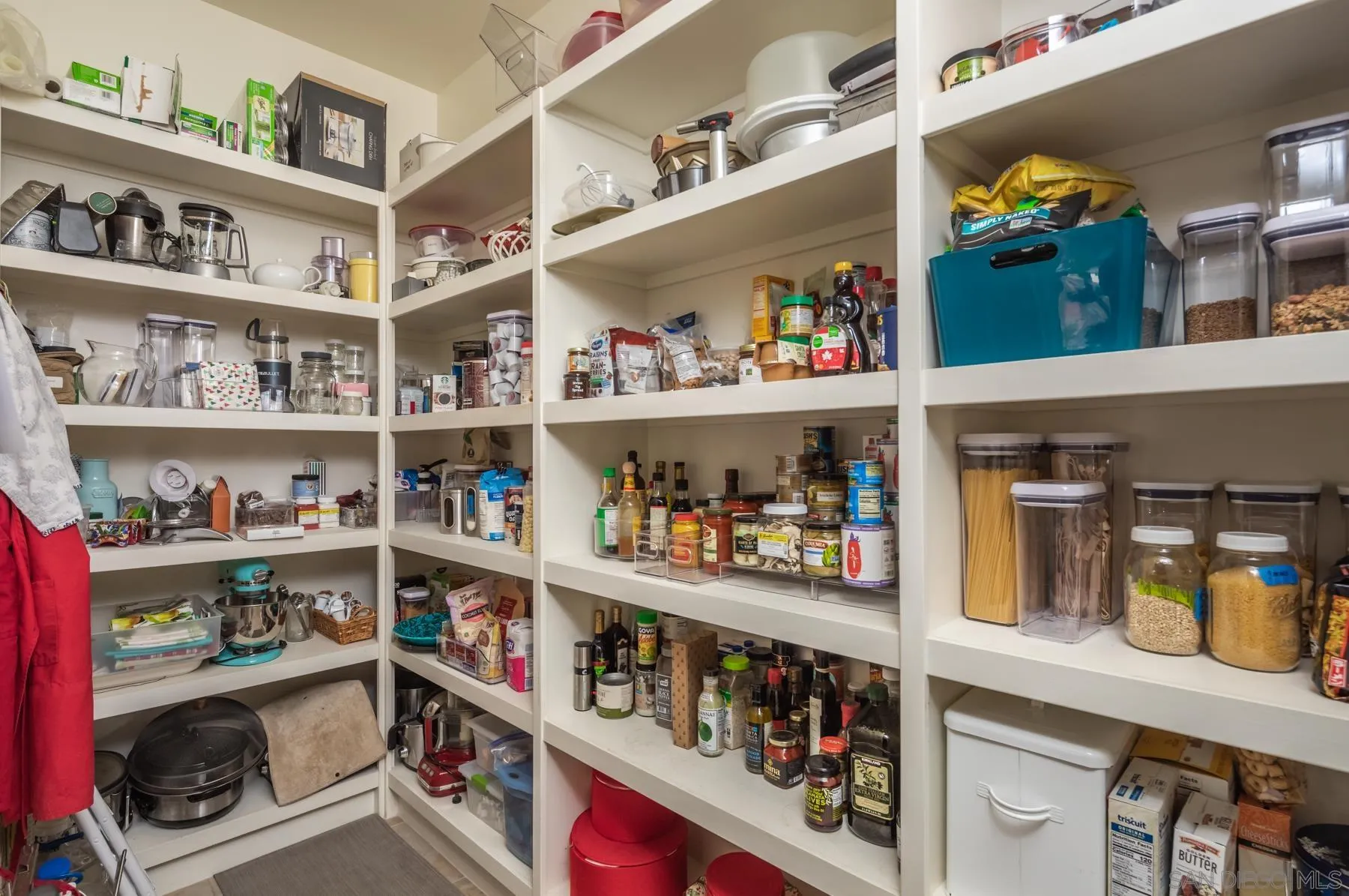 1815 Oak Avenue Carlsbad, CA 92008 - Photo 14 of 46 a room with wine cabinets and a book shelf