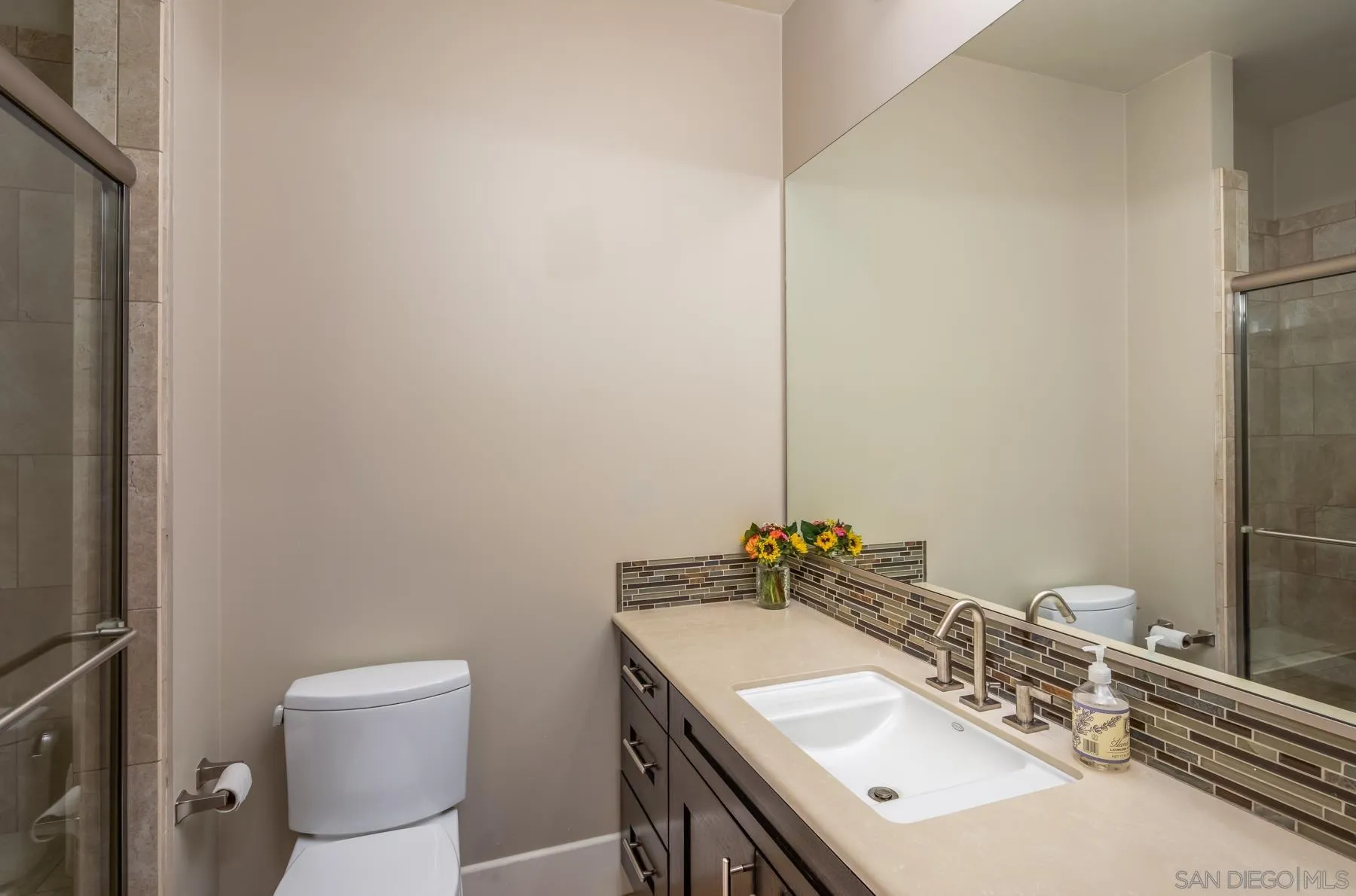 1815 Oak Avenue Carlsbad, CA 92008 - Photo 33 of 46 a bathroom with a sink toilet and a mirror