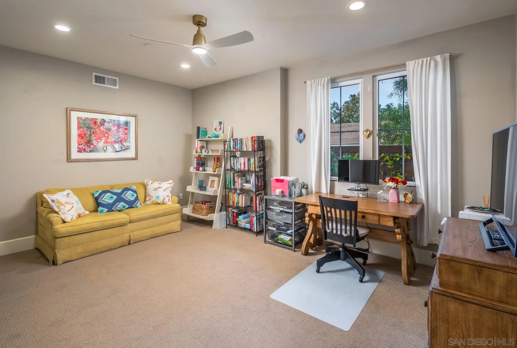 1815 Oak Avenue Carlsbad, CA 92008 - Photo 34 of 46 a living room with furniture and a flat screen tv