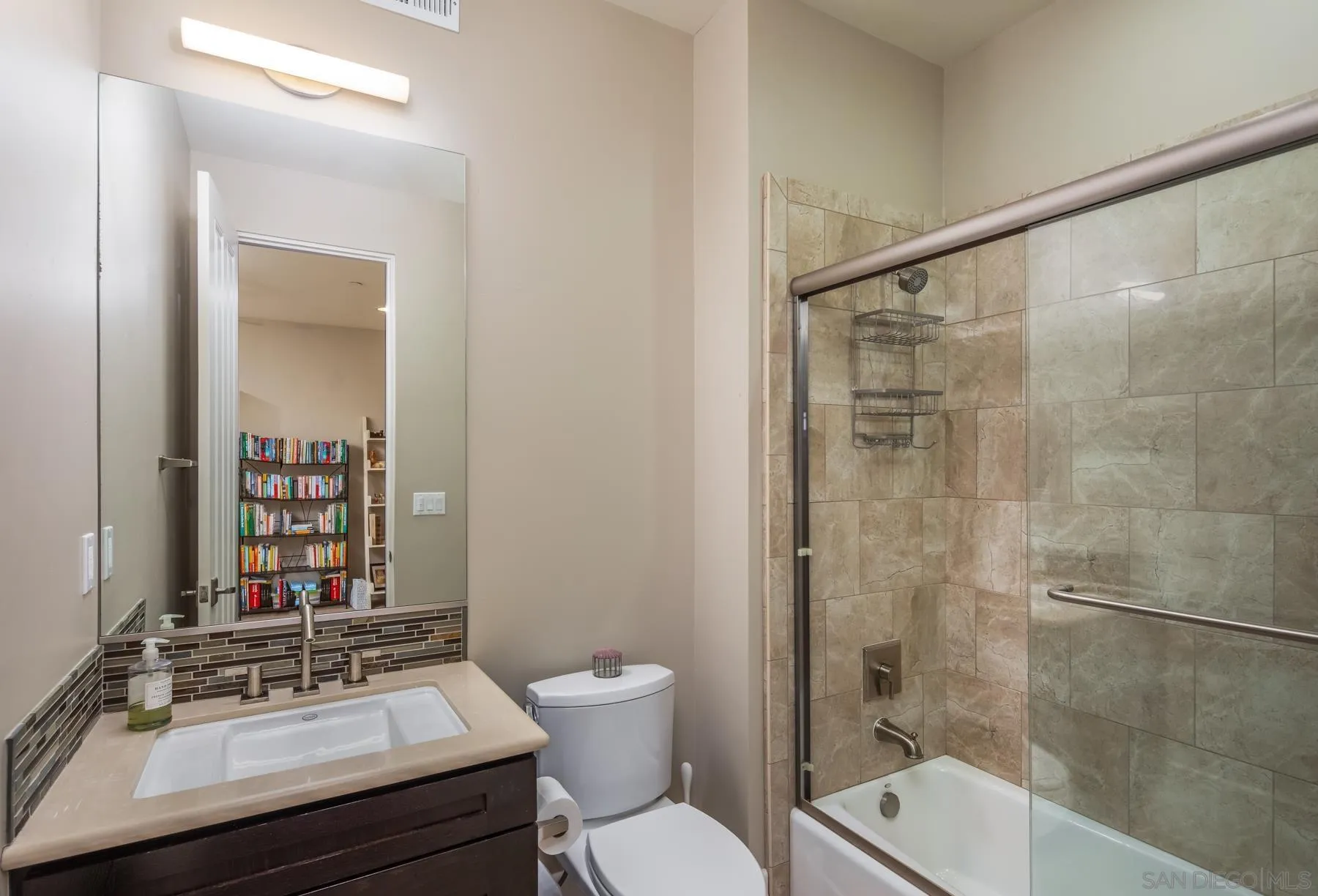 1815 Oak Avenue Carlsbad, CA 92008 - Photo 35 of 46 a bathroom with a sink toilet a mirror and shower