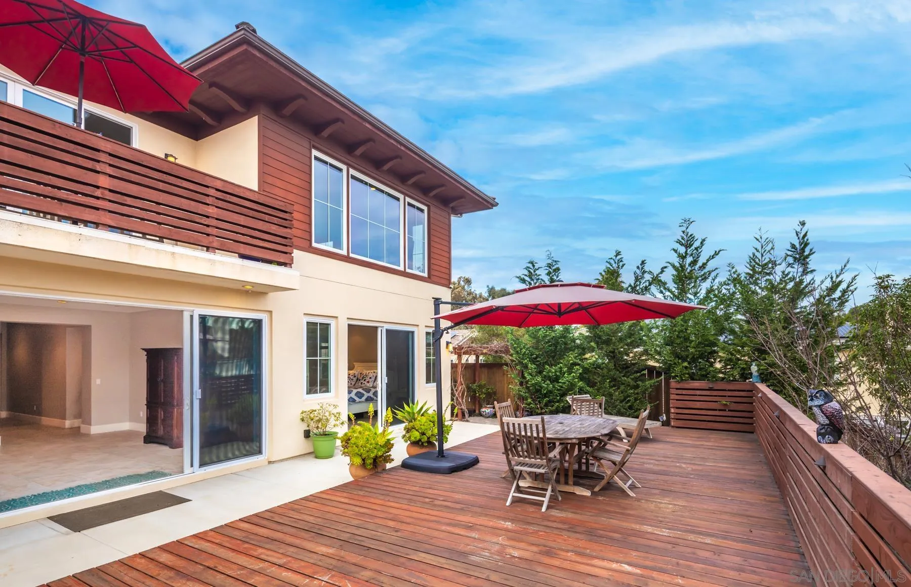 1815 Oak Avenue Carlsbad, CA 92008 - Photo 41 of 46 a view of a patio with a table and chairs under an umbrella