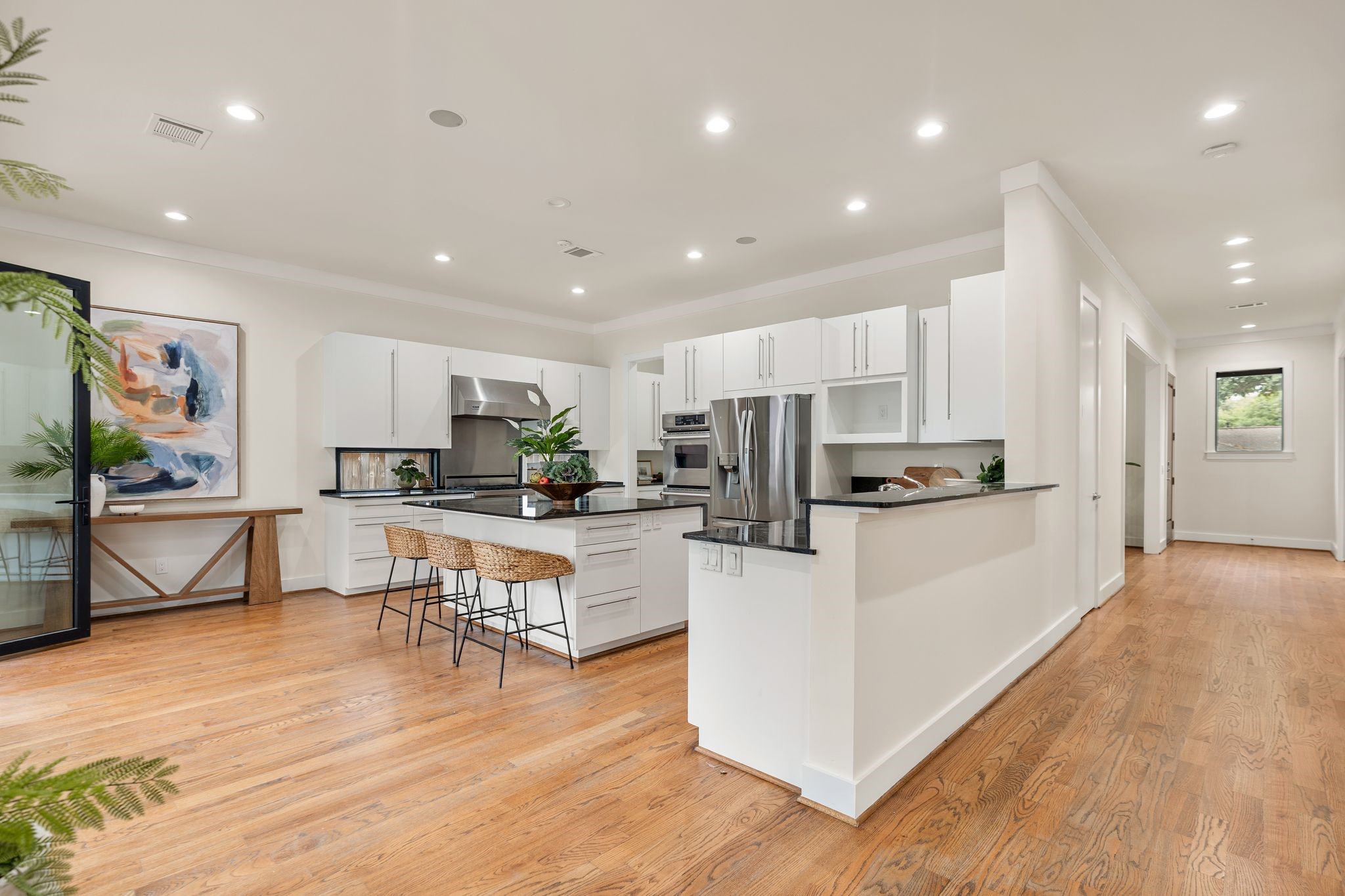 3847 Durness Way Houston, TX 77025 - Photo 13 of 48 Seen here are counter and bar height seating areas and access to the patio off of the kitchen.