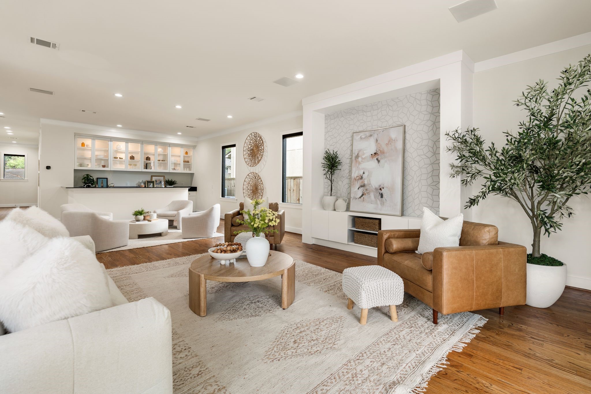 3847 Durness Way Houston, TX 77025 - Photo 14 of 48 The living room showcases custom built-ins and is fully wired for surround sound, creating both style and function. Just off the bar, a thoughtfully designed lounge area provides additional storage, cabinetry, a beverage fridge, and space for an ice maker perfect for effortless entertaining.