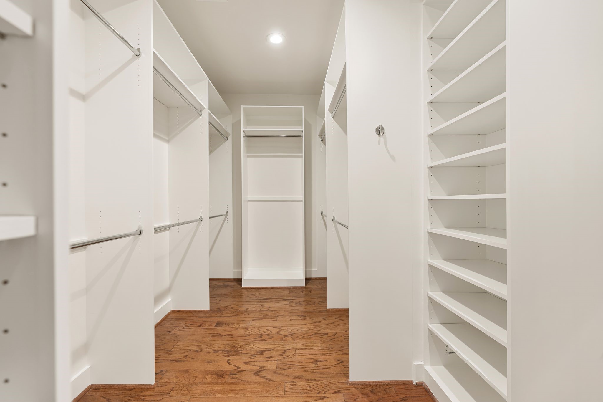 3847 Durness Way Houston, TX 77025 - Photo 26 of 48 The walk-in closet leaves nothing to be desired, featuring extensive built-ins, dedicated shoe storage, and generous hanging space.