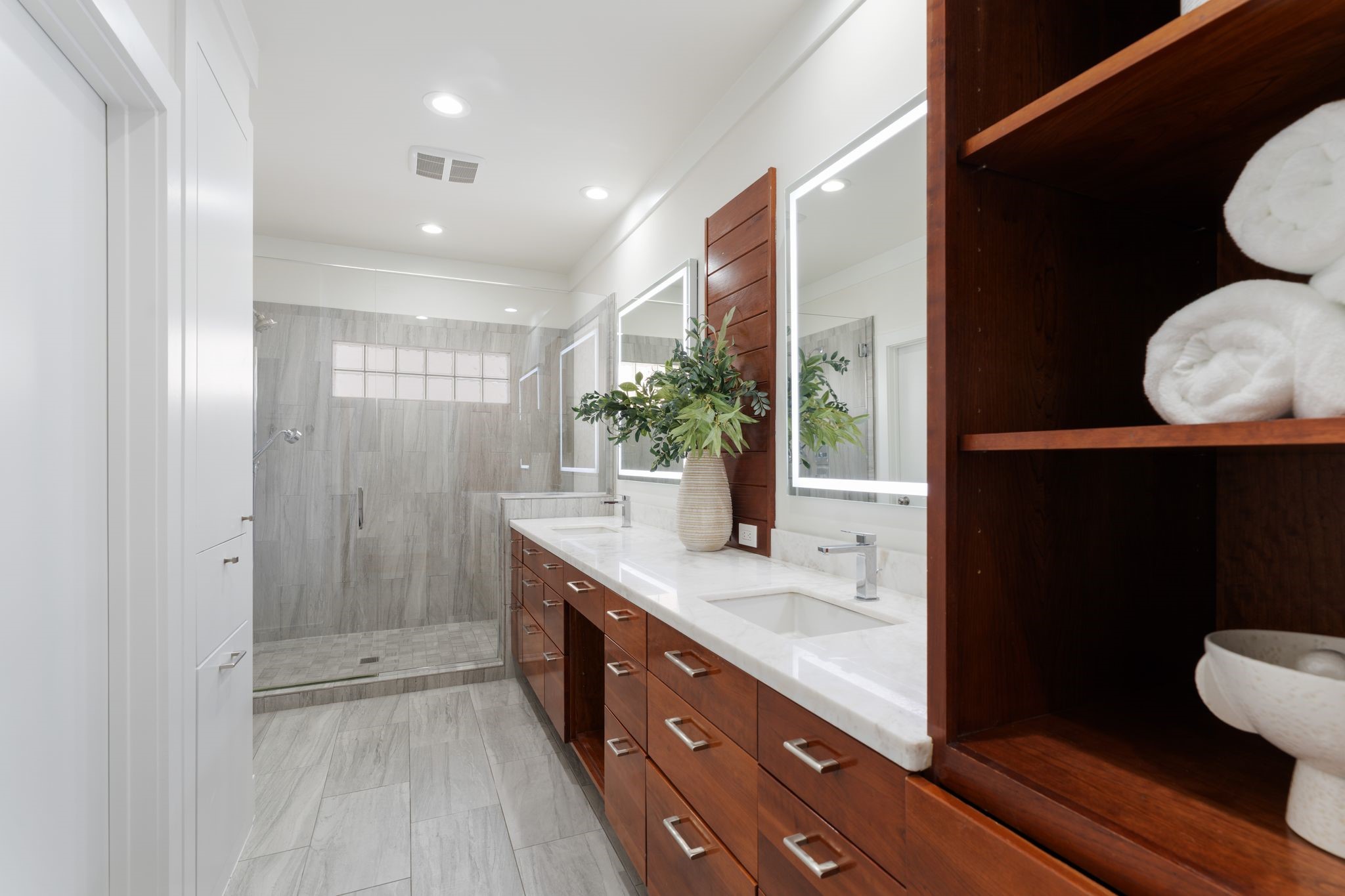 3847 Durness Way Houston, TX 77025 - Photo 28 of 48 The primary bathroom offers abundant counter space and drawer storage, a large walk in shower, and a separate water closet.
