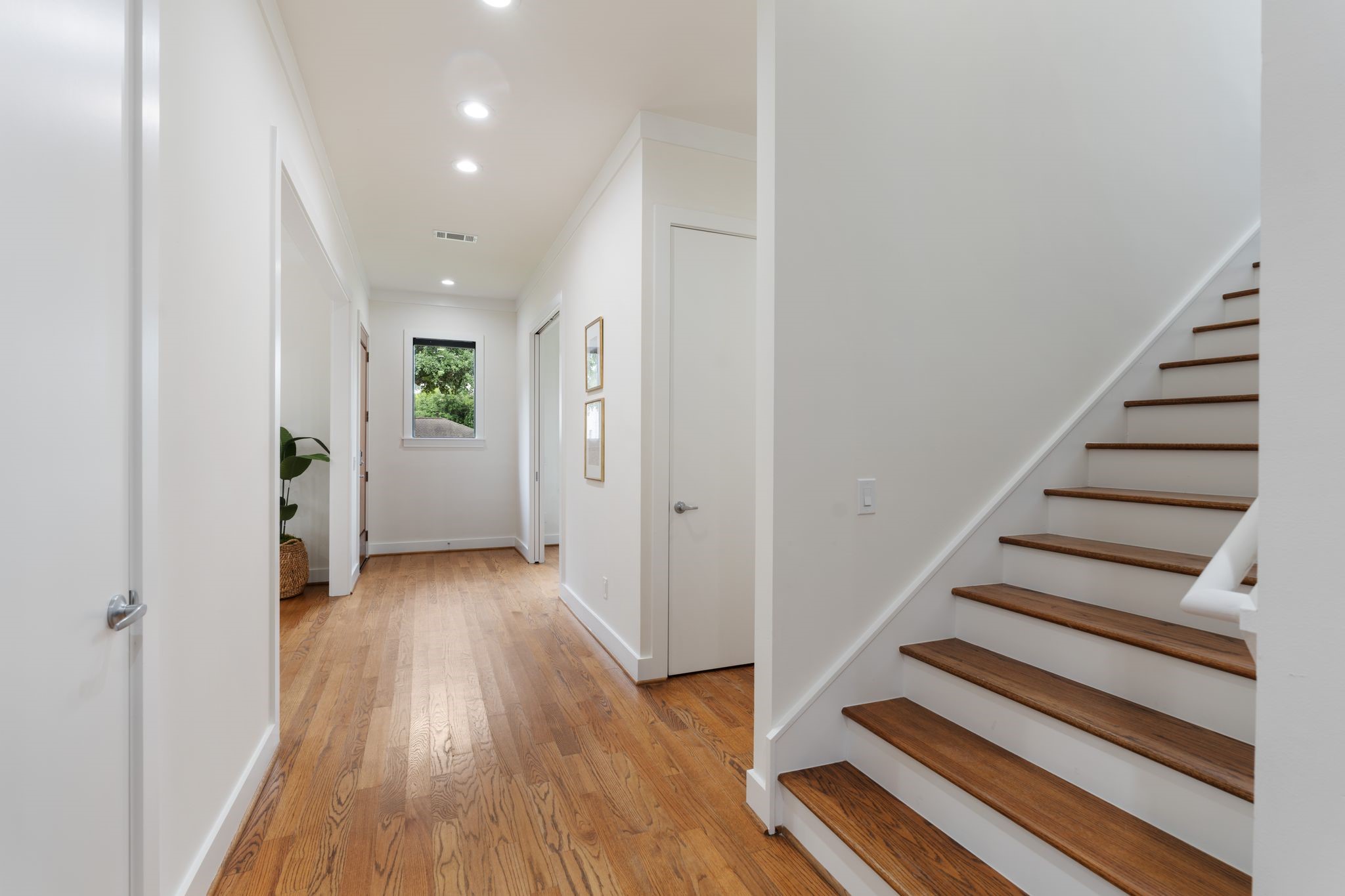 3847 Durness Way Houston, TX 77025 - Photo 8 of 48 Make your way down the hall, lined with a generous run of storage closets, leading to the guest bath at the end.