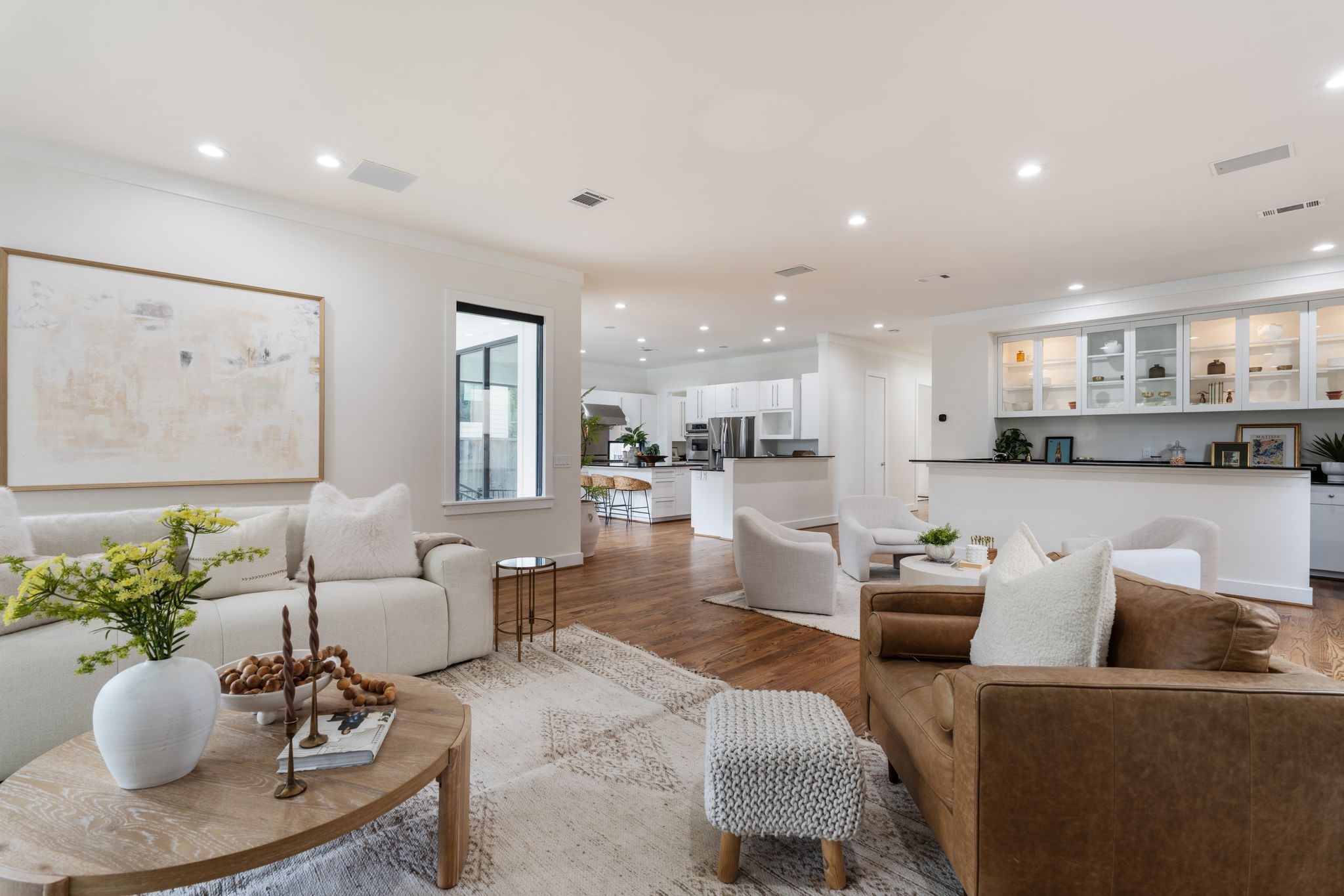 3847 Durness Way Houston, TX 77025 - Photo 9 of 48 This home offers an exceptional layout, with designated dining, office, and bar spaces flowing seamlessly into the open living area and expansive kitchen, all framed by beautiful windows throughout.