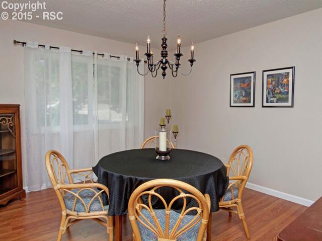 2608 Rigel Drive Colorado Springs, CO 80906 - Photo 9 of 26 Dining room with hardwood flooring