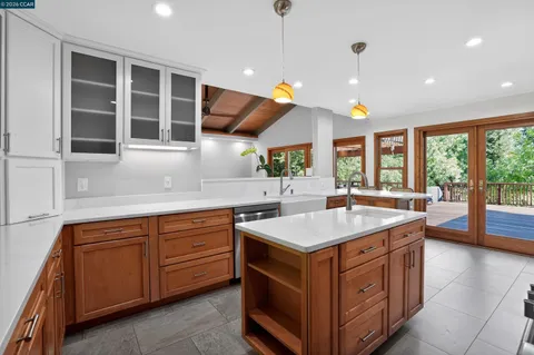 a bathroom with a double vanity sink toilet and shower