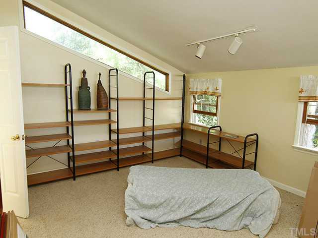 309 Cedar Street Raleigh, NC 27604 - Photo 20 of 25 Upstairs 3rd bedroom features a full custom bathroom. Bedroom