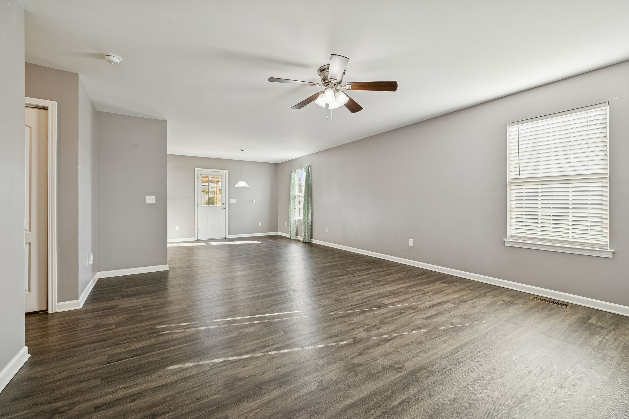 444 Edgewood Street Alexandria, TN 37012 - Photo 3 of 22 a view of empty room with wooden floor and fan