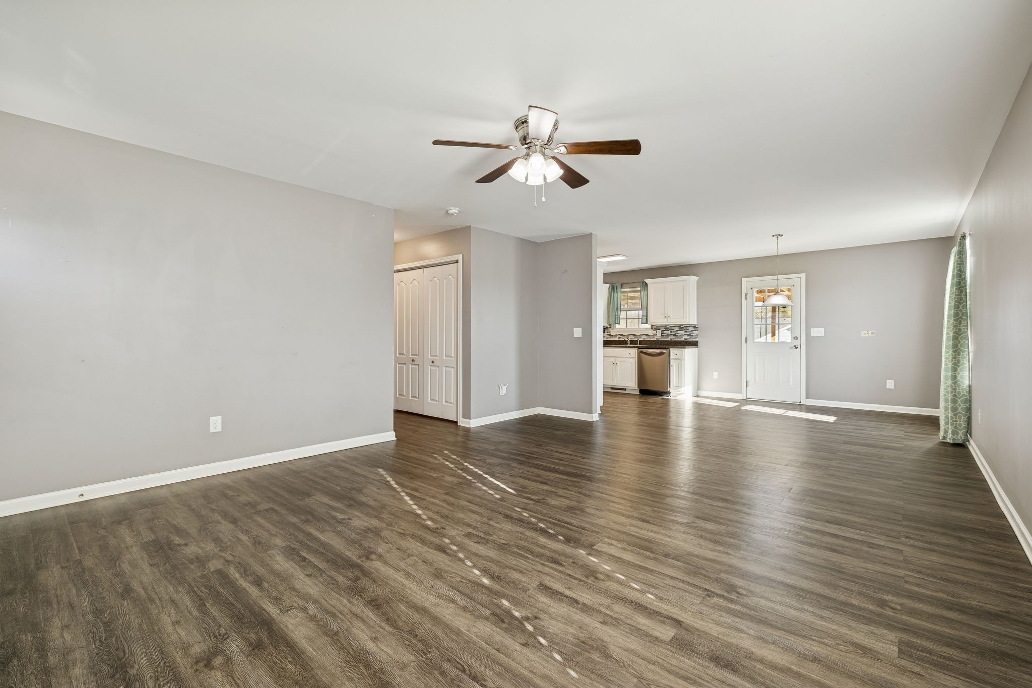 444 Edgewood Street Alexandria, TN 37012 - Photo 5 of 22 a view of an empty room with window and wooden floor