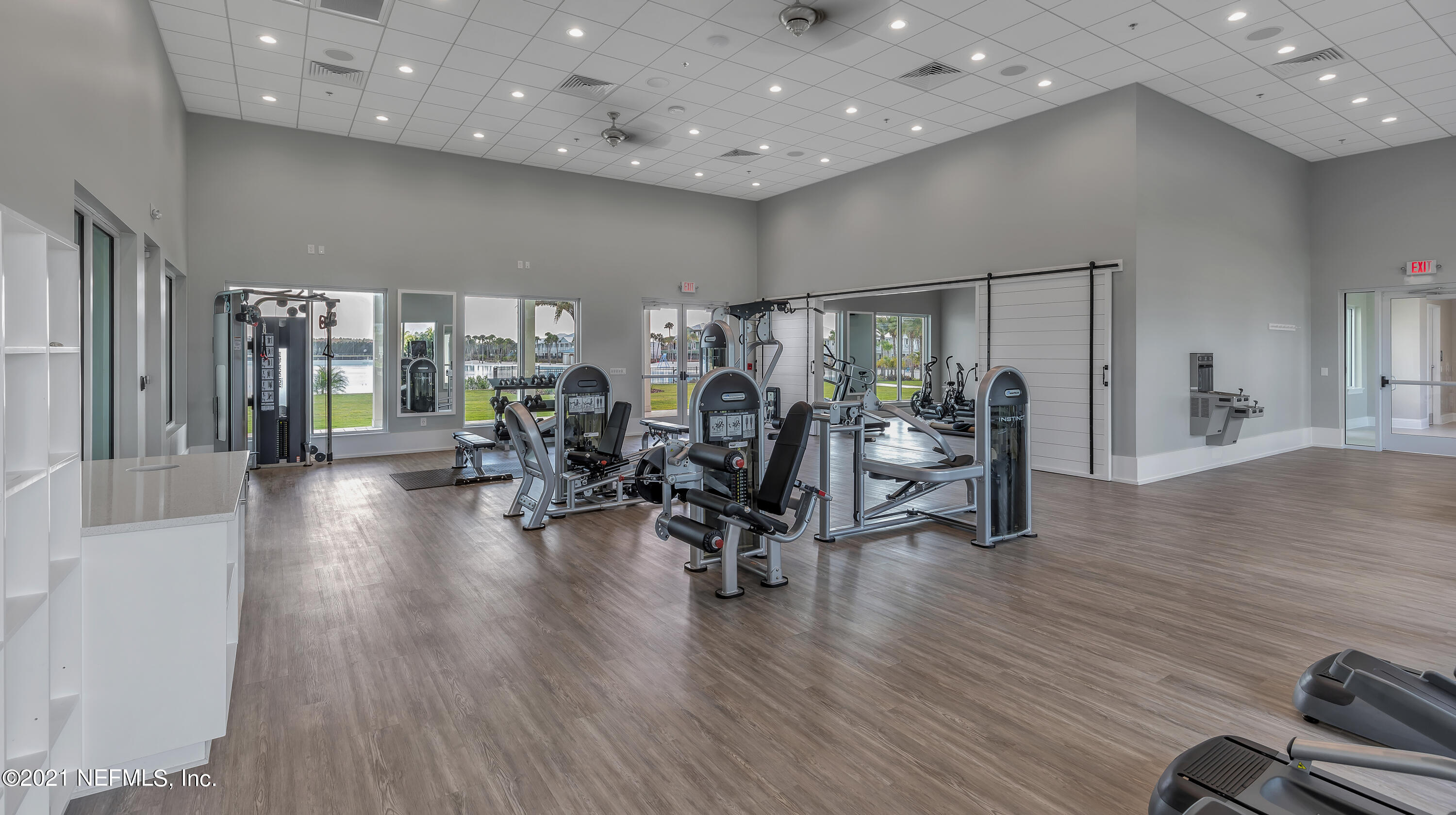 643 Rum Runner Way St. Johns, FL 32259 - Photo 9 of 33 a view of a room with gym equipment and wooden floor