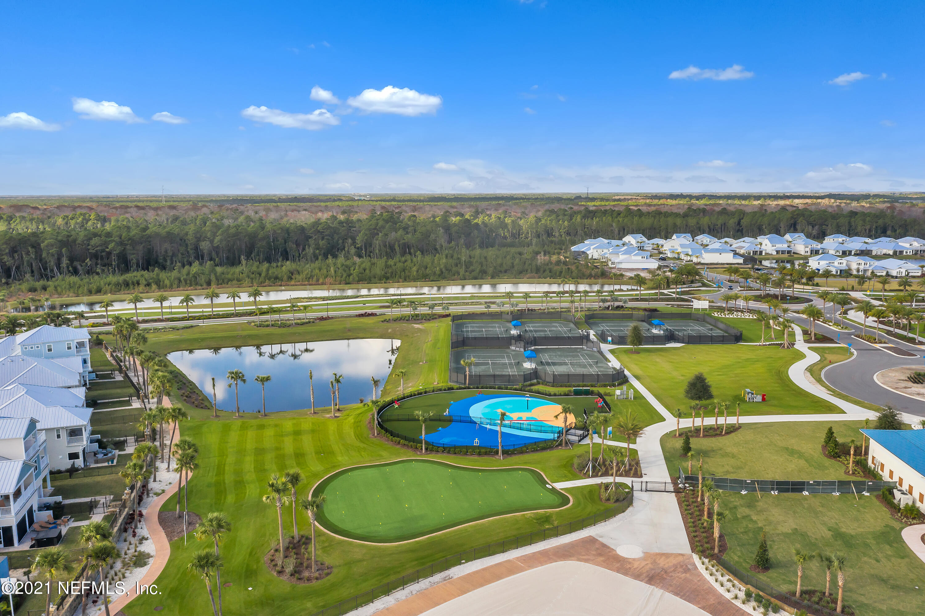 643 Rum Runner Way St. Johns, FL 32259 - Photo 22 of 33 a view of a swimming pool with outdoor seating and yard
