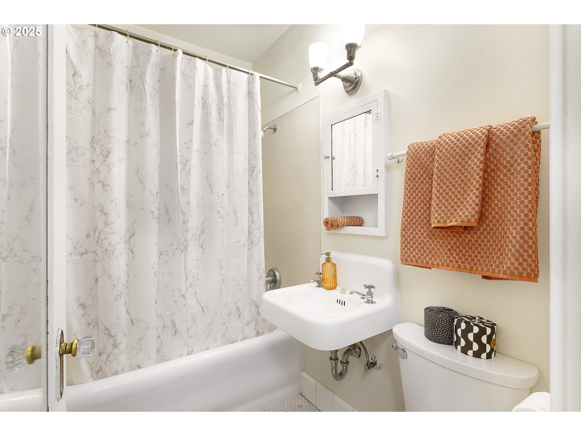 709 Southwest 16th Avenue, Unit 203 Portland, OR 97205 - Photo 11 of 16 a bathroom with a sink and a mirror