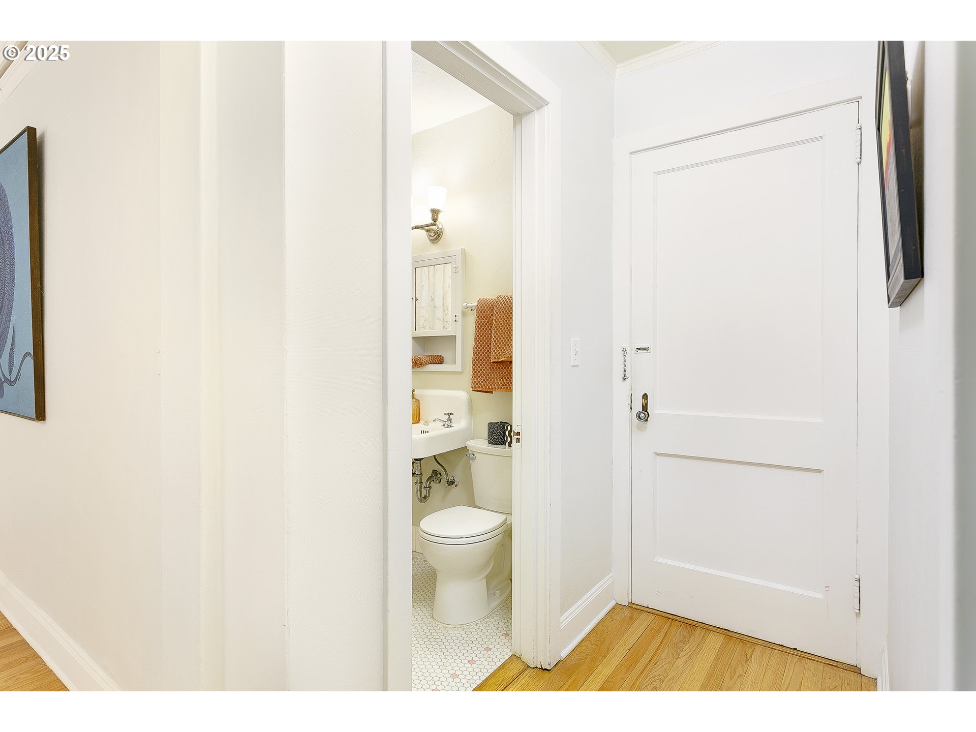709 Southwest 16th Avenue, Unit 203 Portland, OR 97205 - Photo 12 of 16 a bathroom with a sink and a toilet