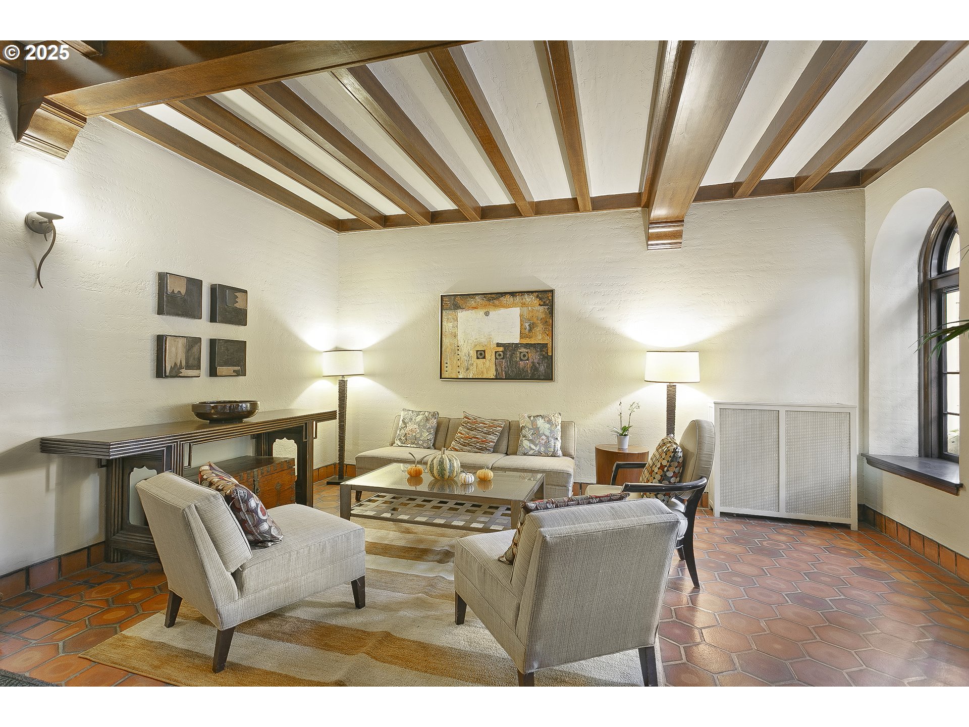 709 Southwest 16th Avenue, Unit 203 Portland, OR 97205 - Photo 3 of 16 a living room with furniture a fireplace and a table