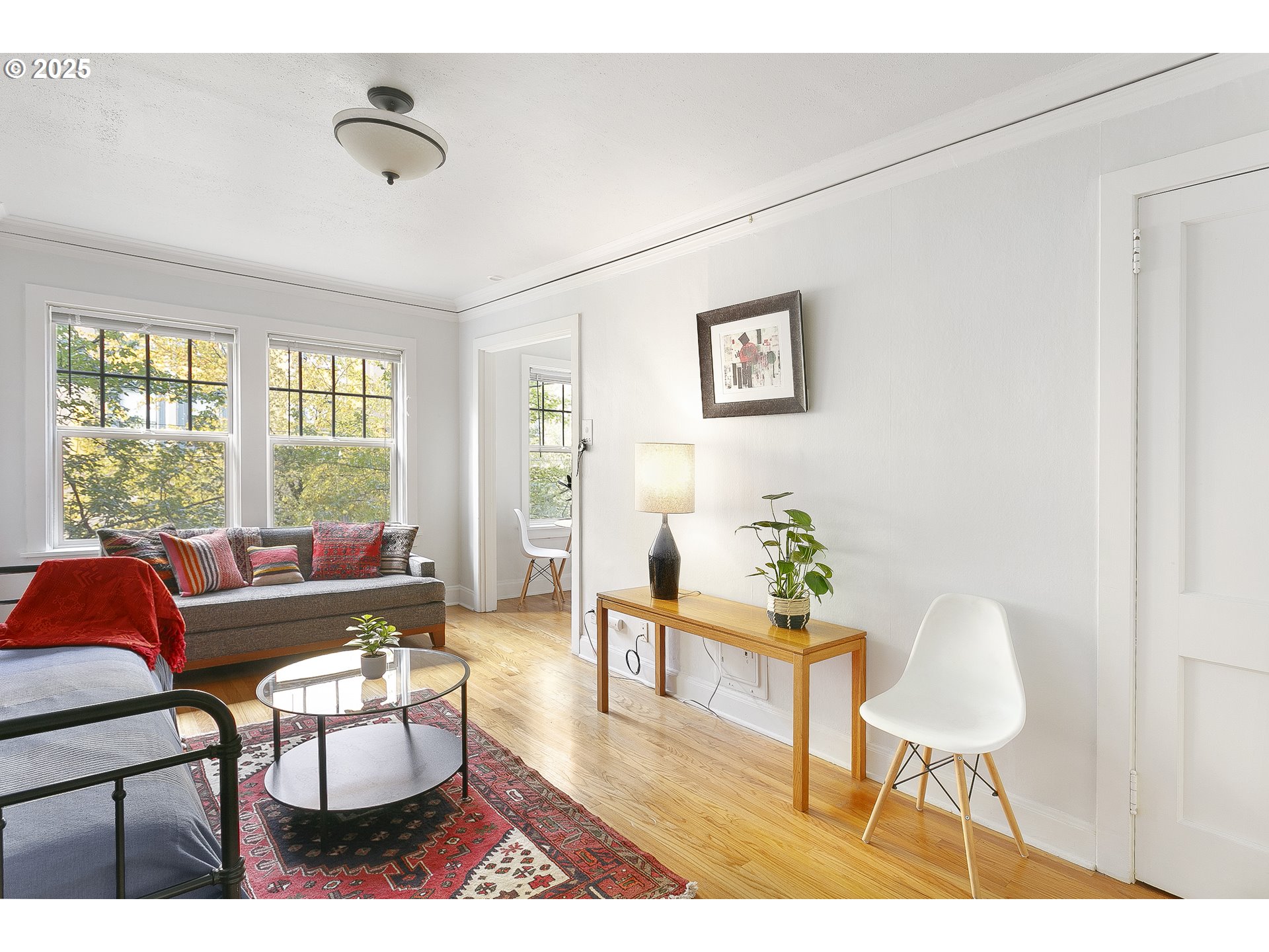 709 Southwest 16th Avenue, Unit 203 Portland, OR 97205 - Photo 4 of 16 a living room with furniture and a large window