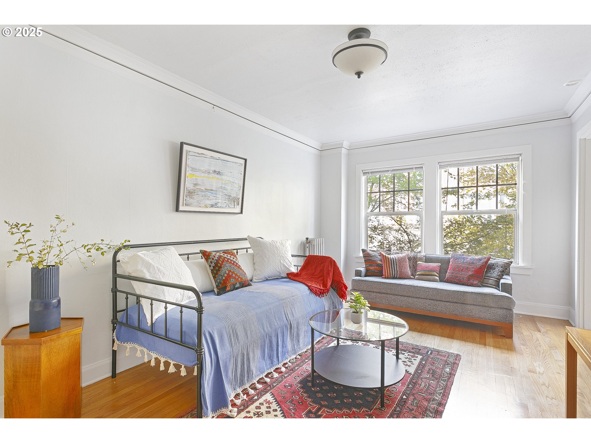 709 Southwest 16th Avenue, Unit 203 Portland, OR 97205 - Photo 6 of 16 a living room with furniture and a window