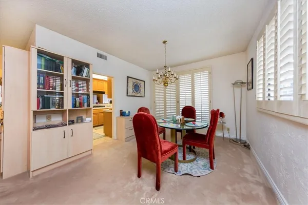 a dining room with furniture and window