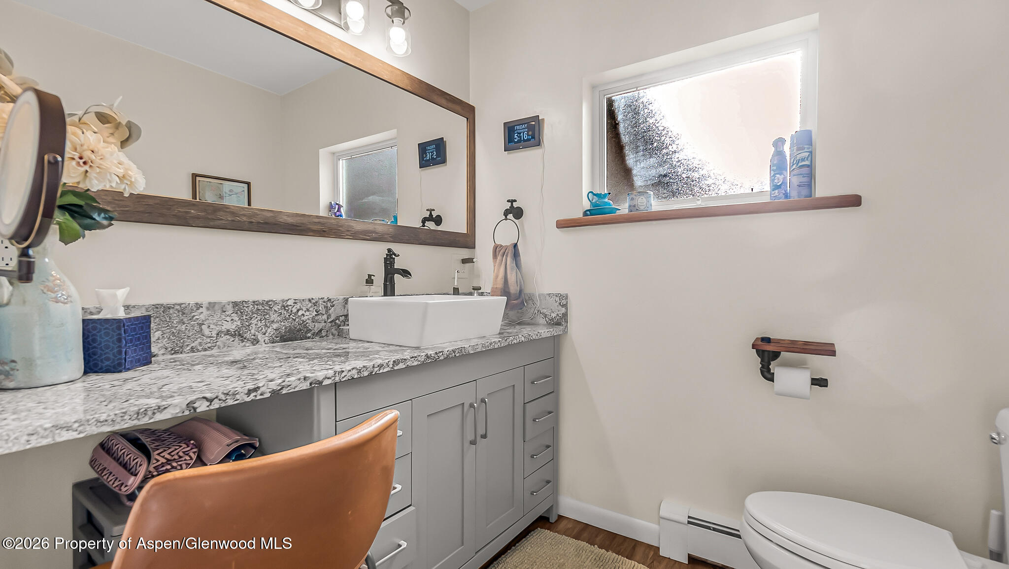 134 4th Street Meeker, CO 81641 - Photo 15 of 47 a bathroom with a granite countertop sink a mirror and toilet