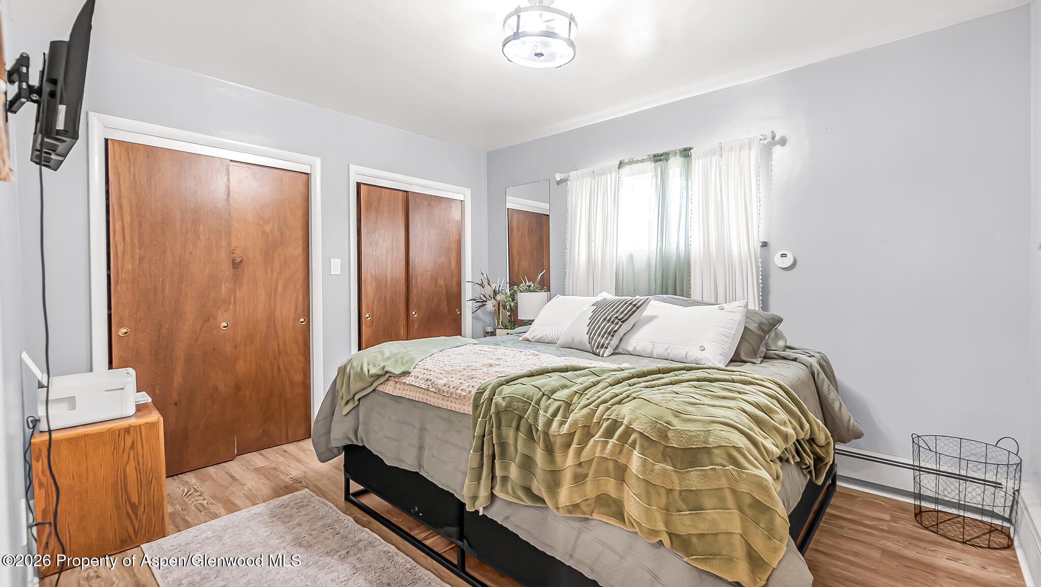 134 4th Street Meeker, CO 81641 - Photo 16 of 47 a bedroom with a bed and wooden floor