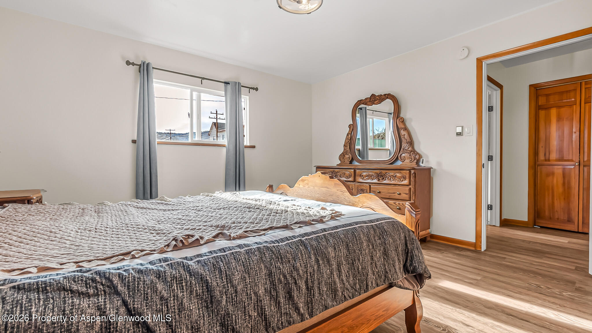 134 4th Street Meeker, CO 81641 - Photo 25 of 47 a bedroom with a bed and wooden floor