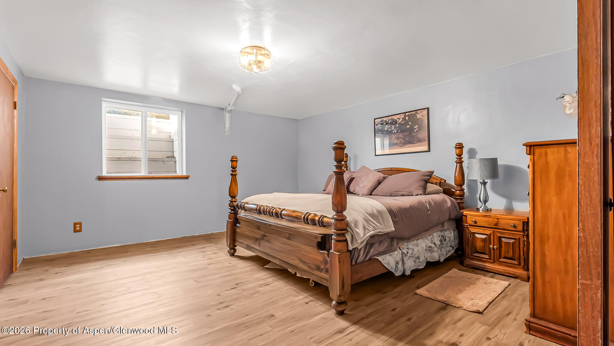 134 4th Street Meeker, CO 81641 - Photo 30 of 47 a spacious bedroom with a bed and a window