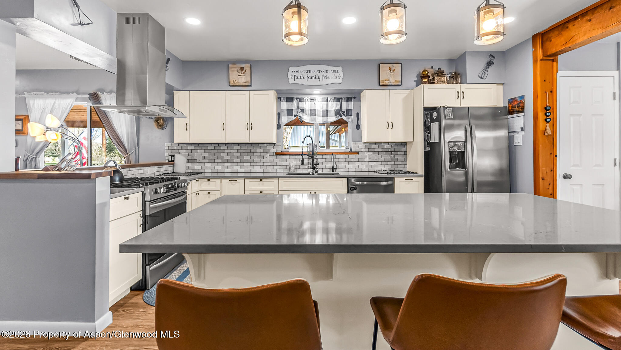 134 4th Street Meeker, CO 81641 - Photo 3 of 47 a kitchen with stainless steel appliances granite countertop a sink refrigerator and cabinets