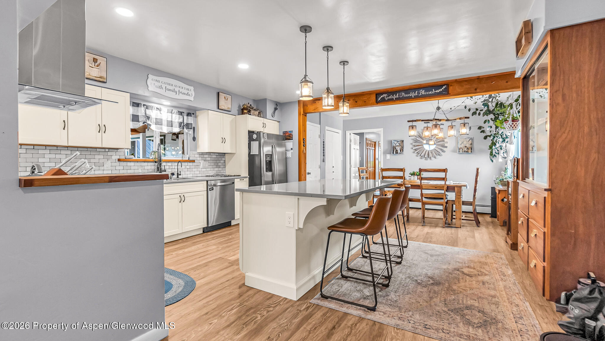 134 4th Street Meeker, CO 81641 - Photo 6 of 47 a very nice looking kitchen with granite countertop a large window and stainless steel appliances