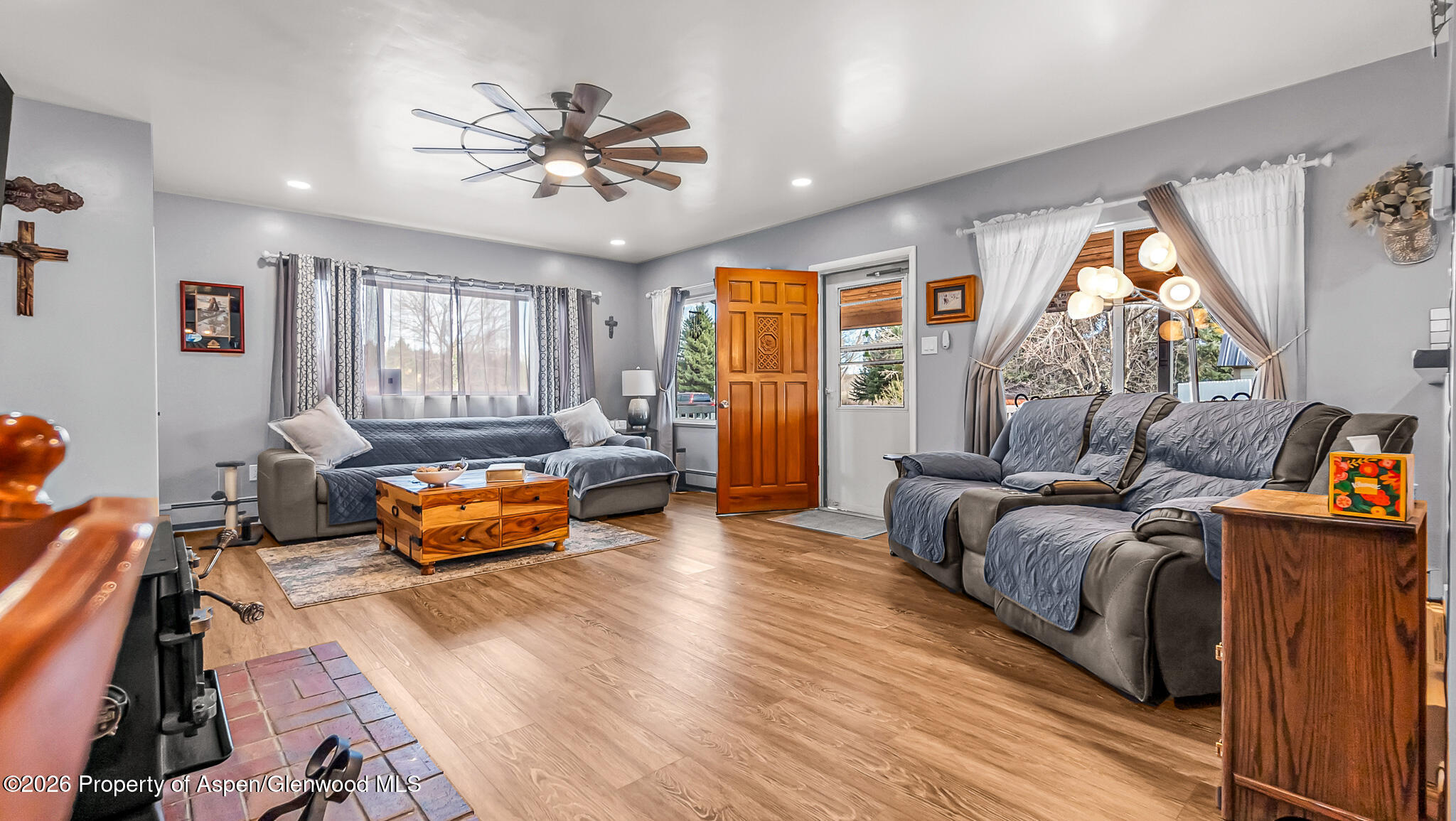 134 4th Street Meeker, CO 81641 - Photo 7 of 47 a living room with furniture fireplace and a large window