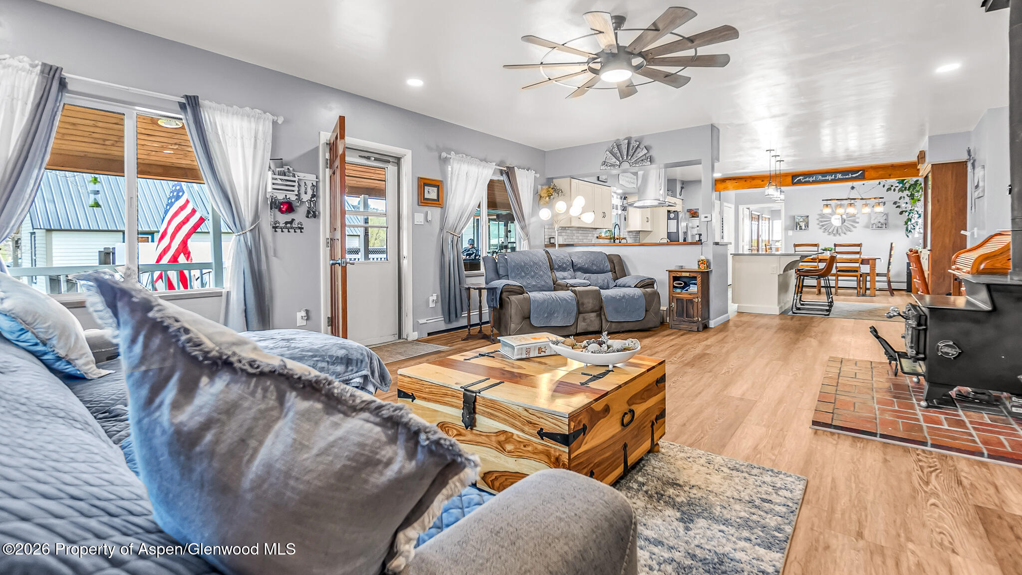 134 4th Street Meeker, CO 81641 - Photo 8 of 47 a living room with furniture a wooden floor and chandelier
