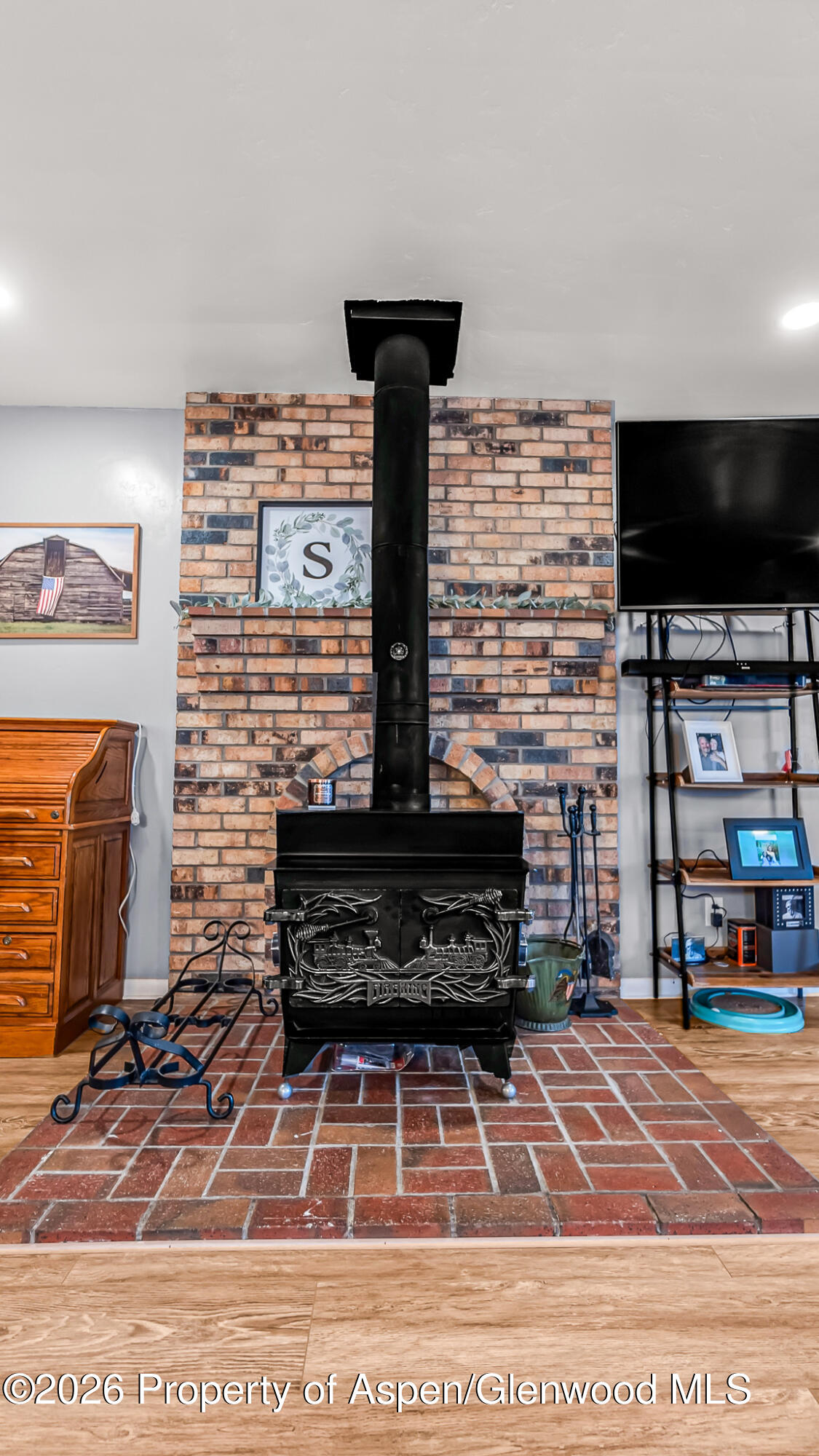 134 4th Street Meeker, CO 81641 - Photo 9 of 47 a living room with a flat screen tv and a fireplace