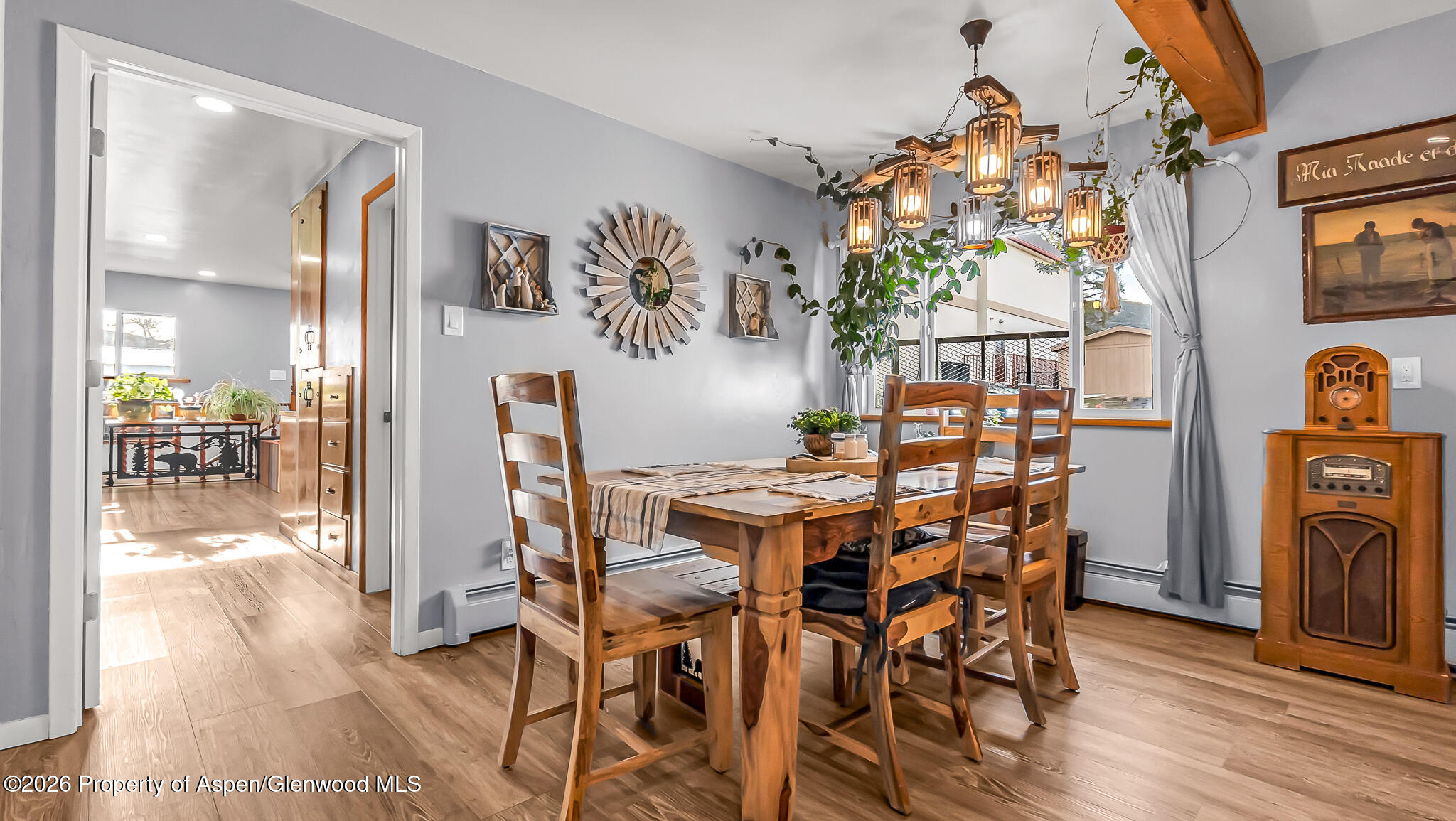 134 4th Street Meeker, CO 81641 - Photo 10 of 47 a view of a dining room with furniture wooden floor and chandelier