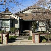 a view of a building with sitting area