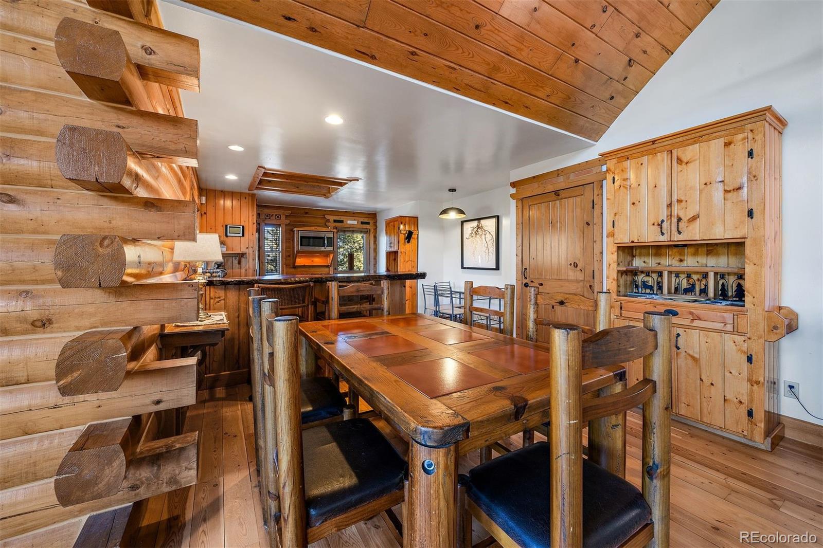 55 Rd P78 Bailey, CO 80421 - Photo 12 of 43 a dining room with stainless steel appliances lots of furniture