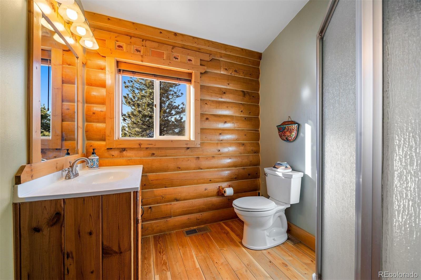 55 Rd P78 Bailey, CO 80421 - Photo 18 of 43 a bathroom with a sink and a mirror