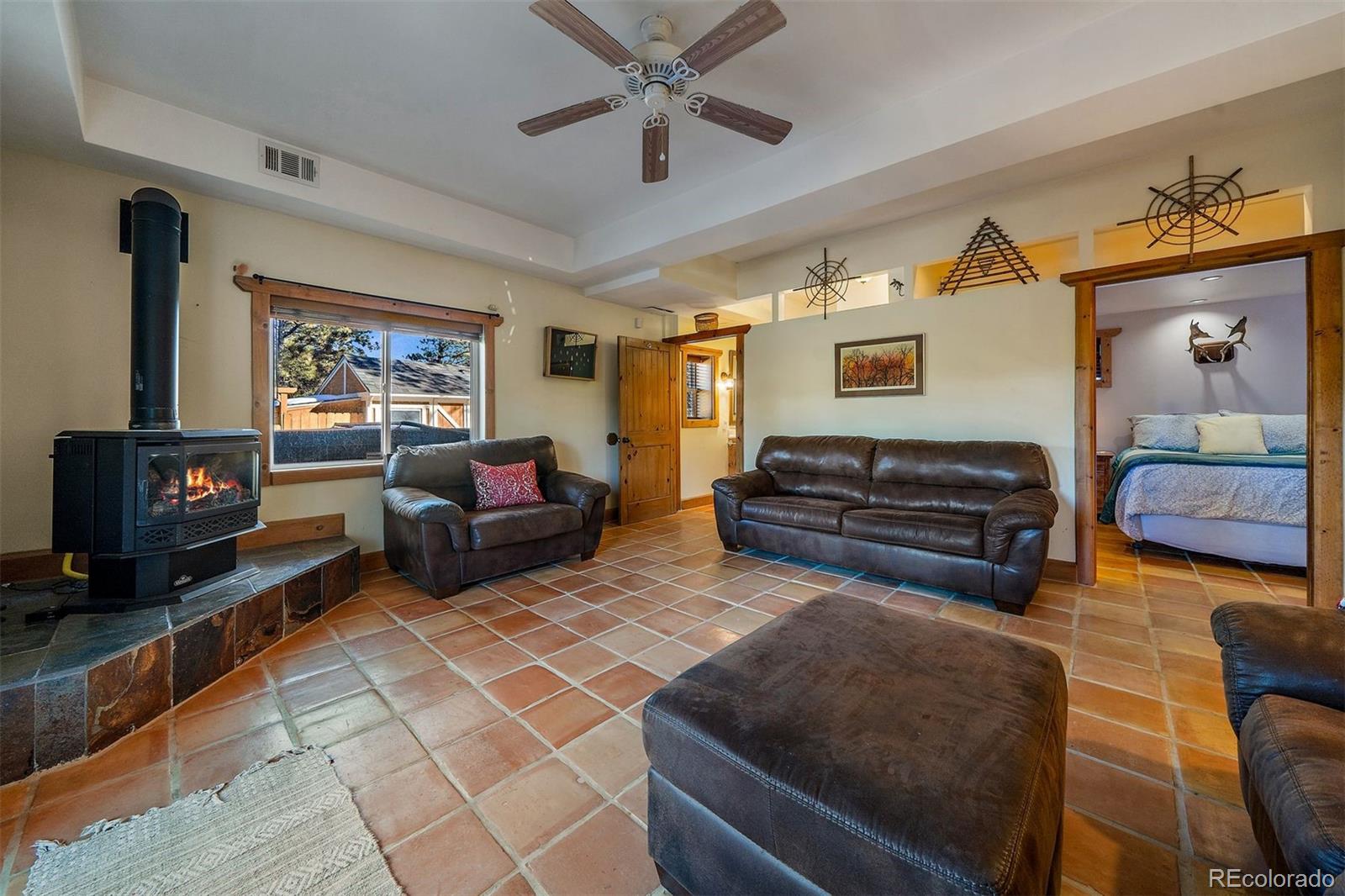 55 Rd P78 Bailey, CO 80421 - Photo 25 of 43 a living room with furniture ceiling fan and a flat screen tv