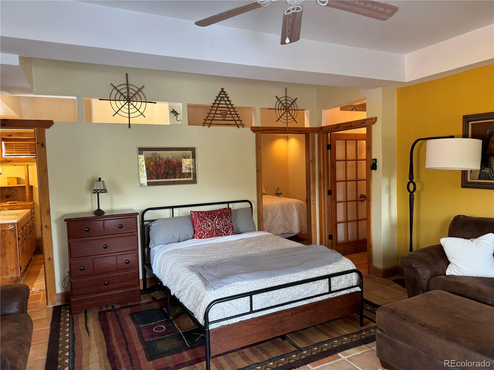 55 Rd P78 Bailey, CO 80421 - Photo 27 of 43 a bedroom with a bed and wooden floor