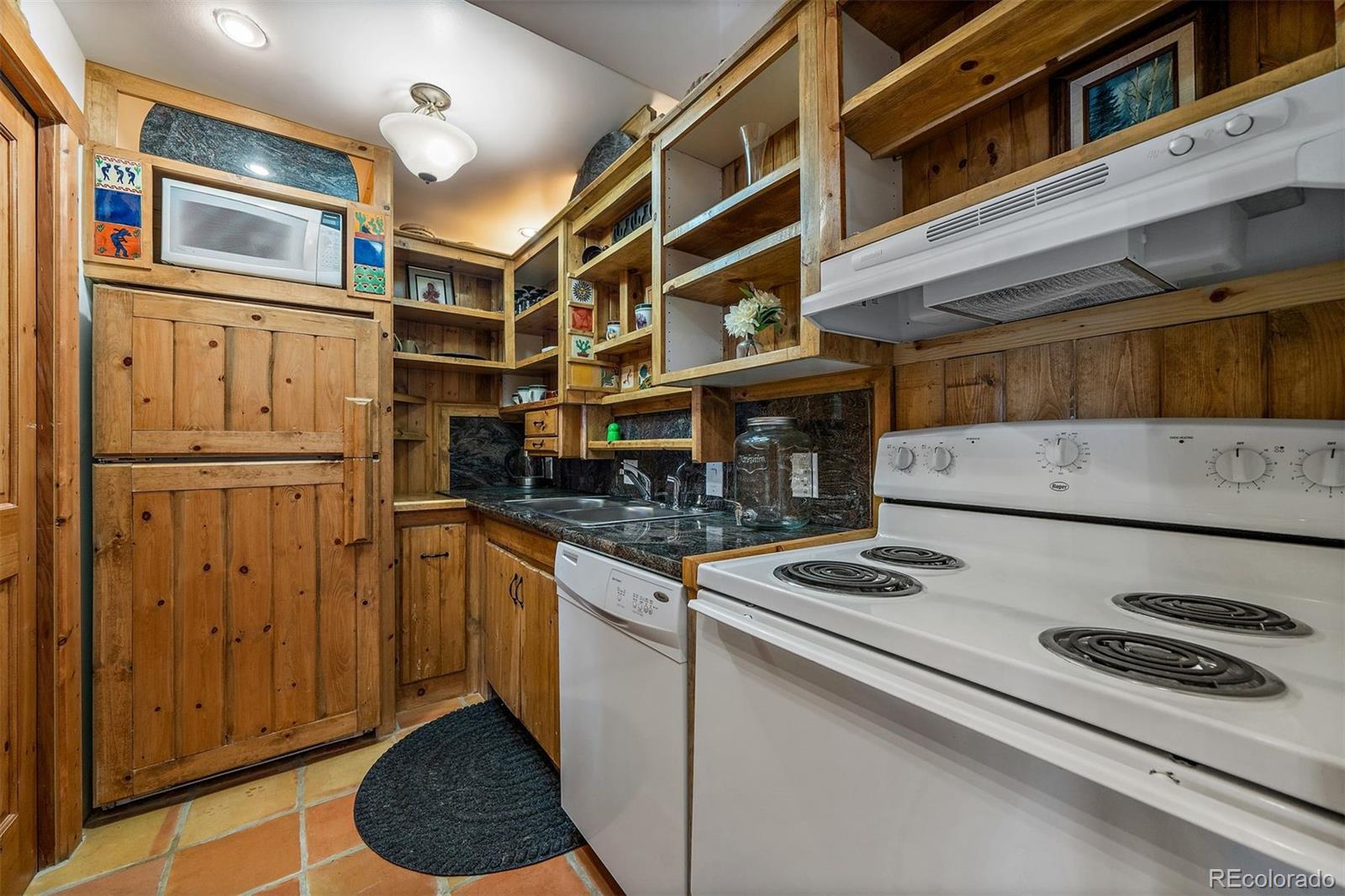 55 Rd P78 Bailey, CO 80421 - Photo 30 of 43 a kitchen with stainless steel appliances granite countertop a stove and a refrigerator