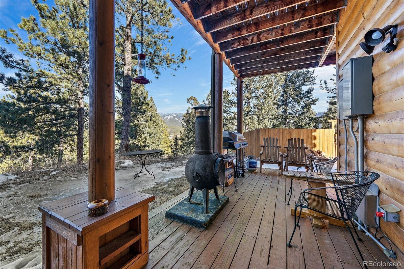 55 Rd P78 Bailey, CO 80421 - Photo 32 of 43 a view of a patio with wooden floor